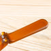 Close-up of a wooden spatula on a light wood background