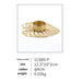 Decorative gold candle holder with leaf-like design on a white background