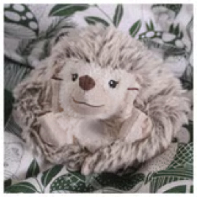 IKEA SKOGSDUVA soft toy – close-up of hedgehog plush with brown nose, embroidered eyes, and leafy background - 70576904