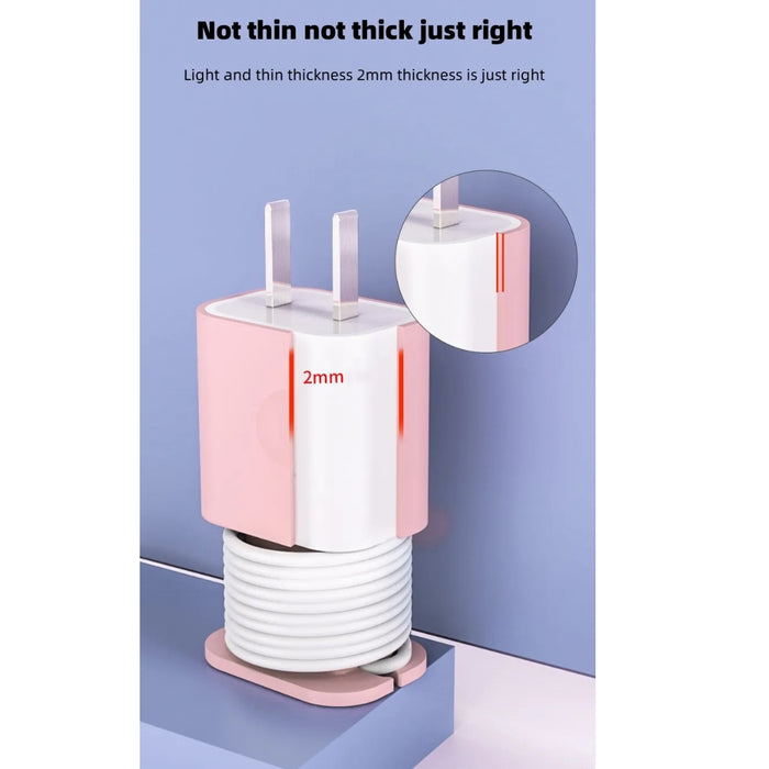 Pink and white cable management device with a close-up detail on a light blue background