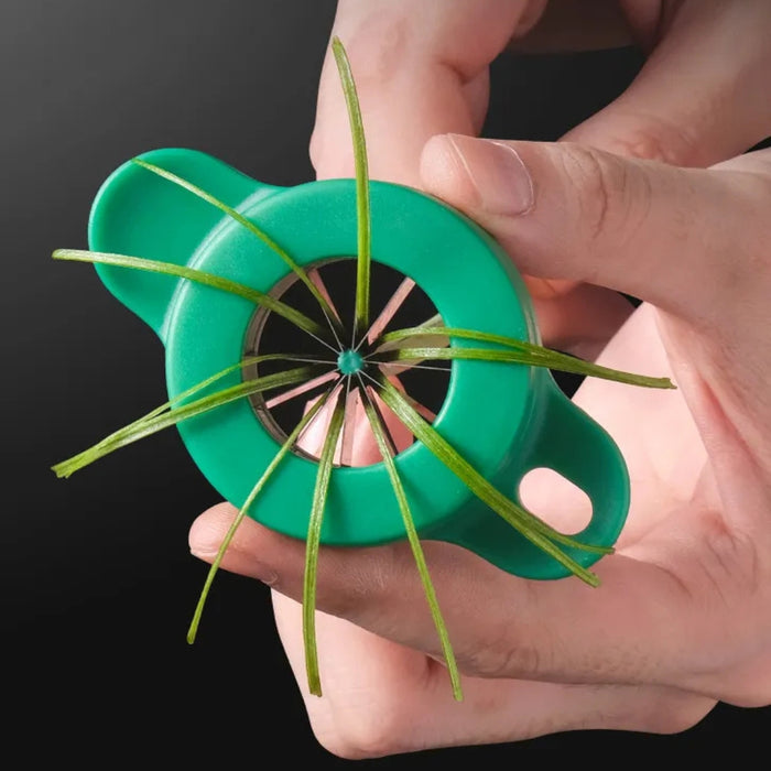 Green handheld herb stripper shown pulling rosemary stem through blade holes – efficiently separates leaves for cooking prep – 1598451114240 13941221