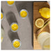 IKEA BLODHÄGG scented tealight – lemon & lemongrass/yellow, candles with lemongrass and lemonade on gray surface - 30571507