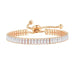 Gold rhinestone bracelet – channel-set rectangular stones with gold bead ends on soft fabric background