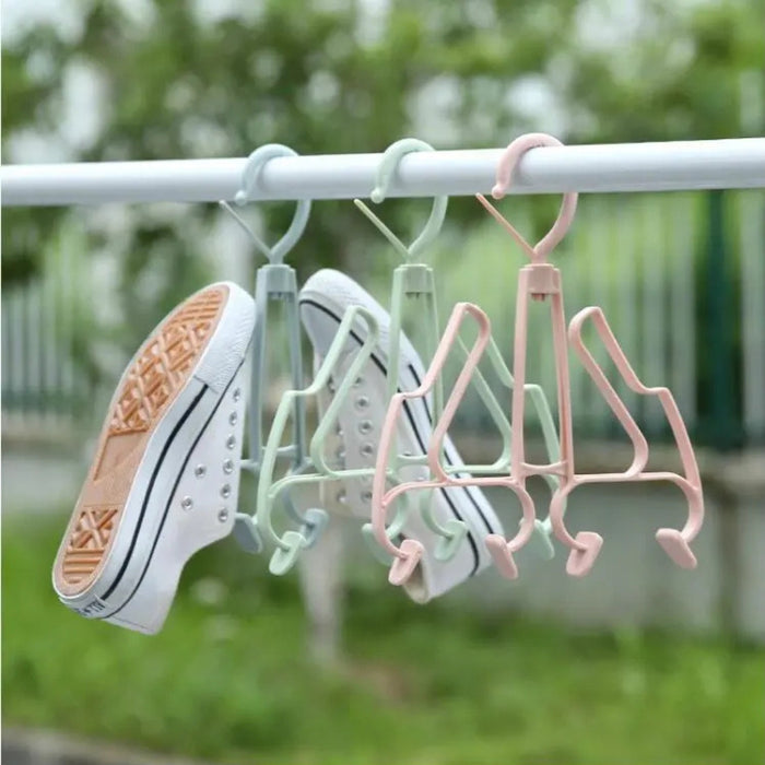 Shoe dryer rack with shoes hanging on it outdoors