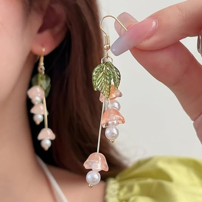 Digital Shoppy Lily of the Valley earrings – nature-inspired earrings with green leaves and cascading flower beads worn by model

