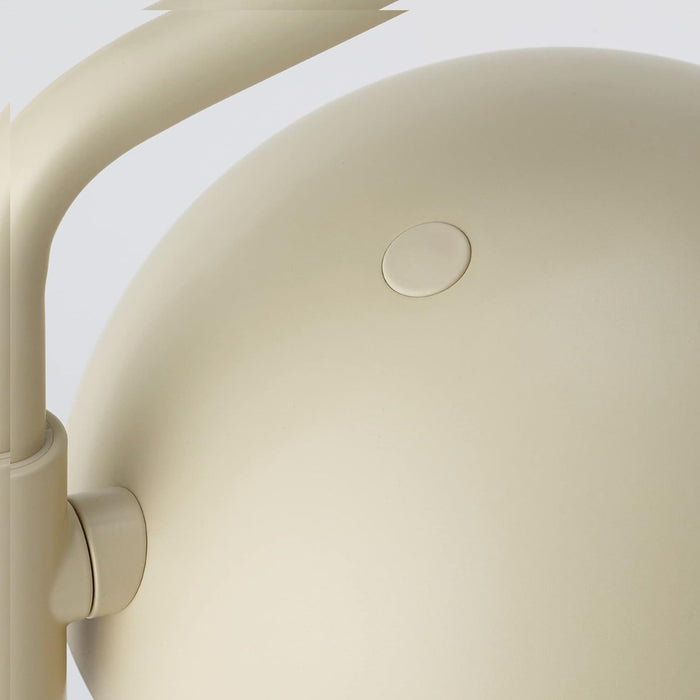 Close-up of IKEA SOMMARLANKE decorative table lamp in beige; smooth rounded surface with circular button and cylindrical hinge – minimalist design ideal for modern home lighting - 20544821