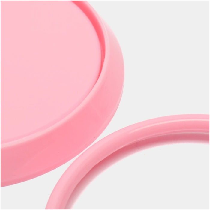 Close-up of two pink silicone rings on a light gray background