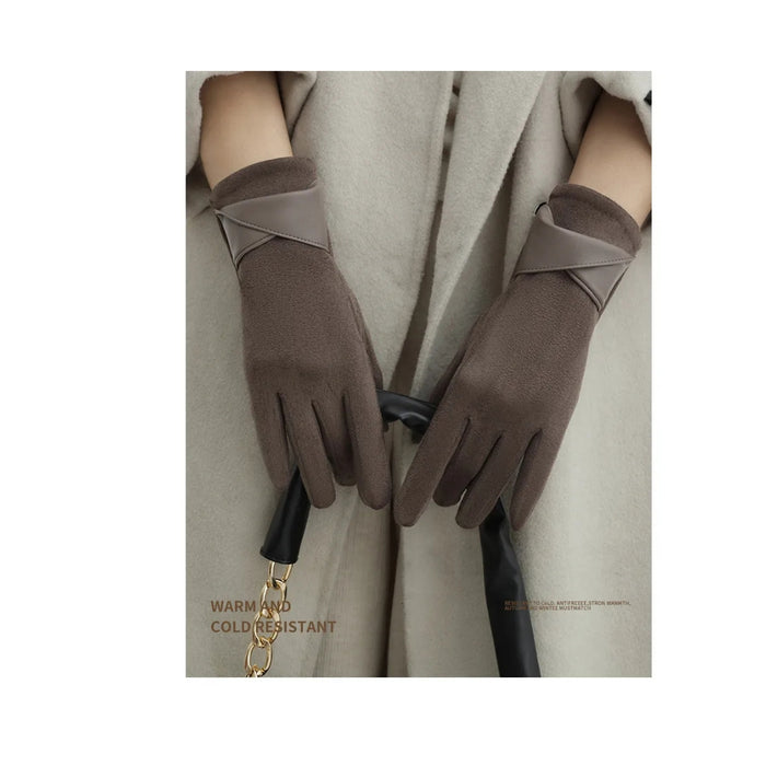 Brown gloves worn with a beige coat on a white background