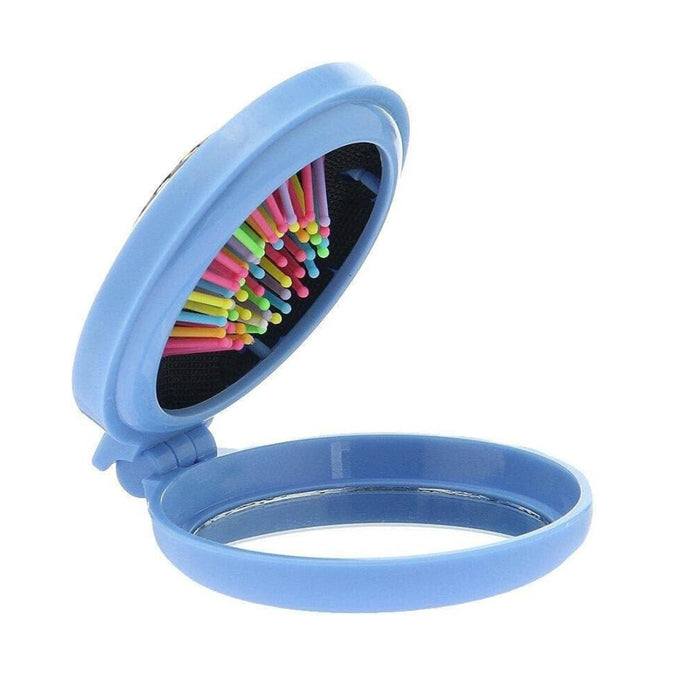 Compact foldable hairbrush placed inside handbag for travel