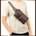 Person modeling dark brown leather crossbody bag with flap and zippered pockets – 1600007588949 14145394