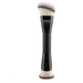 Makeup brush with black handle and white bristles on a white background