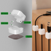 Close-up of silicone-lined jaws holding 0.5-inch thick power cord