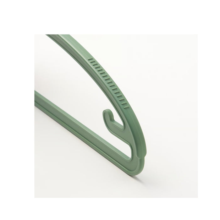 Green plastic hook on a white background