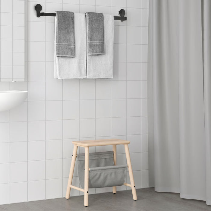 IKEA TISKEN towel rack – modern bathroom setup with black rack holding gray and white towels above stool 20498541