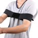 Person wearing a black arm brace on a white background