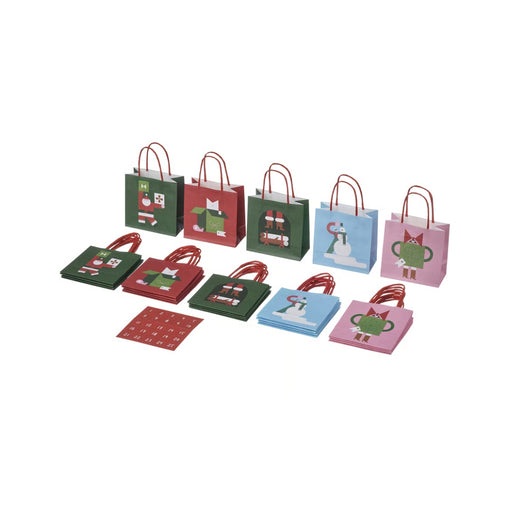 Set of small gift bags with festive designs on a white background