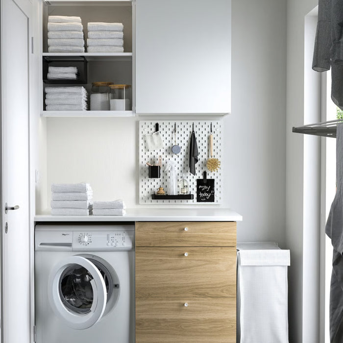 Organized wall with IKEA SKÅDIS black accessories set for tools and supplies