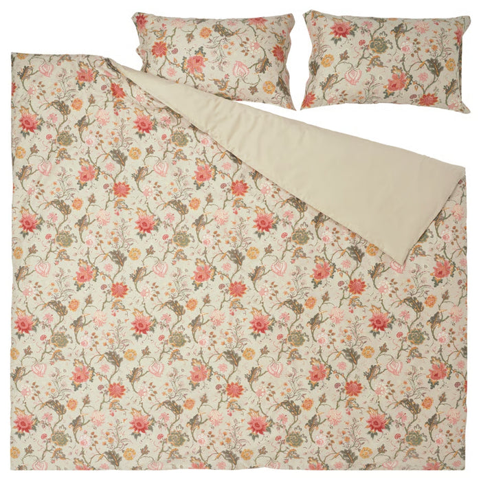 Floral patterned duvet cover set with matching pillows on a white background