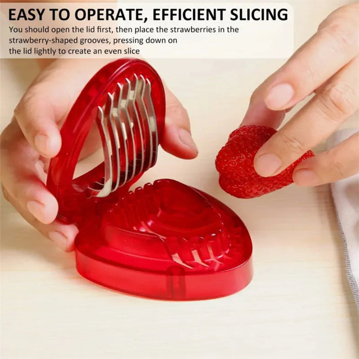 Red strawberry slicer shown with hand placing fruit into grooves – metal blades ready for clean, even slicing – 1261421 13927578
