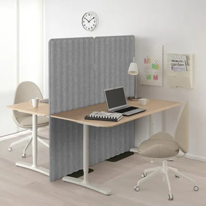 IKEA EILIF black screen support in modern office setup with dual desks and fabric privacy panel