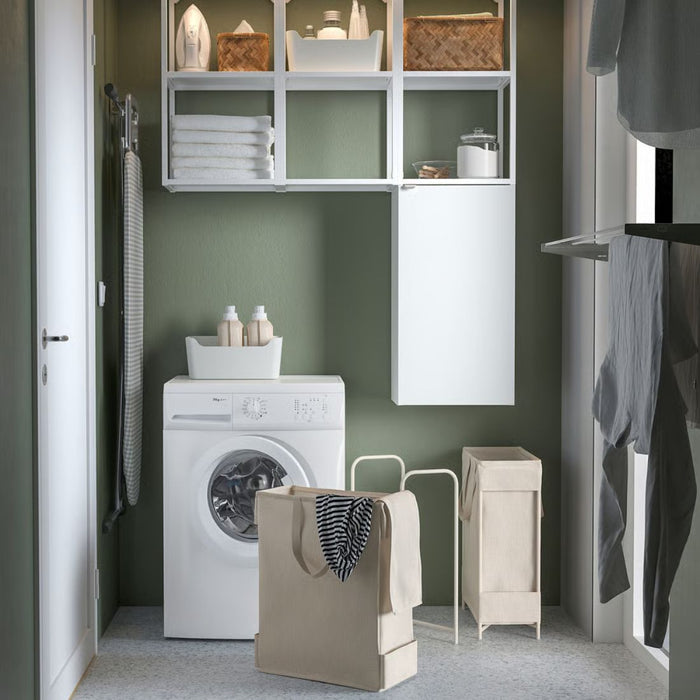 Small laundry room with washing machine, dryer, and shelves.