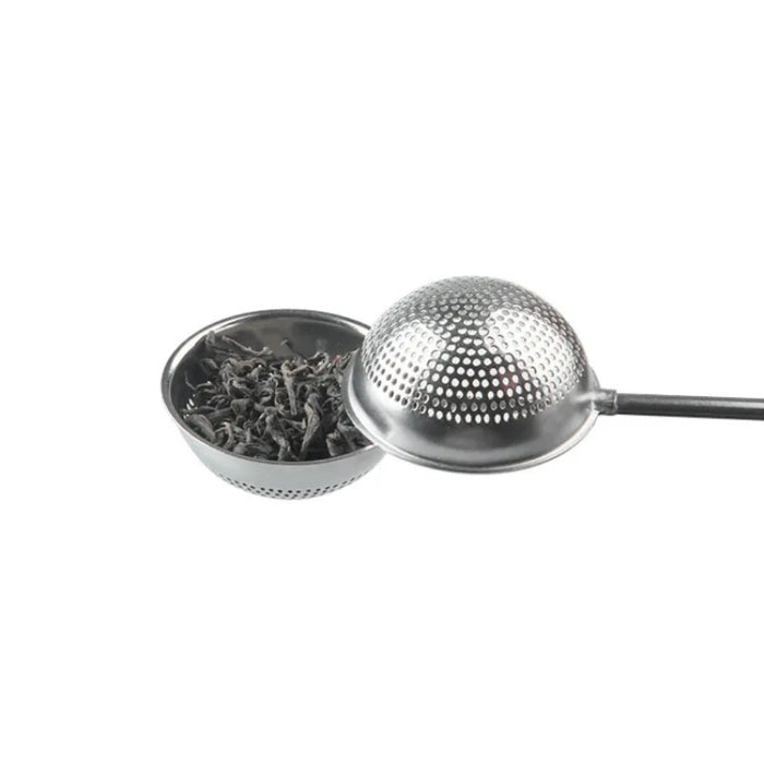 Metallic tea infuser with mesh lid on a white background