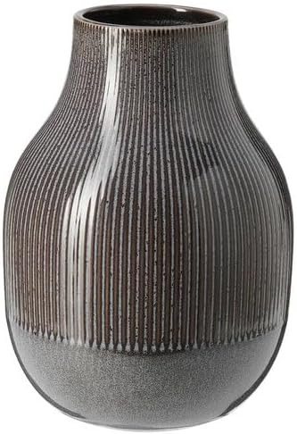 IKEA GRADVIS Vase, dark grey, 21 cm (8¼"), featuring a gently rounded silhouette with a narrow neck and vertical ridges running from top to bottom. The ceramic body transitions from a glossy dark brown at the top to a muted gray base, creating a subtle gradient effect. A modern décor piece ideal for displaying flowers or as a stand-alone accent on shelves or tables.