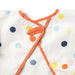 Orange strap on a white background with colorful polka dots