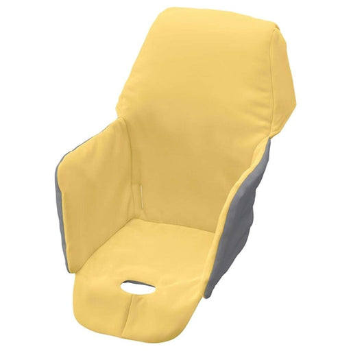 Installing the yellow padded seat cover on an IKEA highchair. The cover is easy to install and fits securely on the highchair.