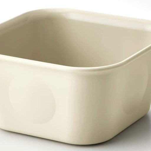 Beige ceramic baking dish on a white background
