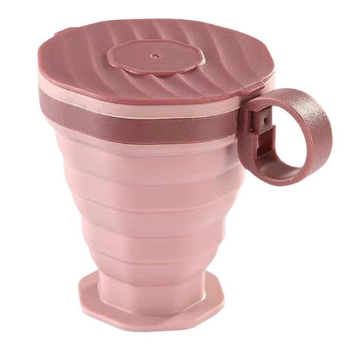 Pink collapsible mug with lid on a white background