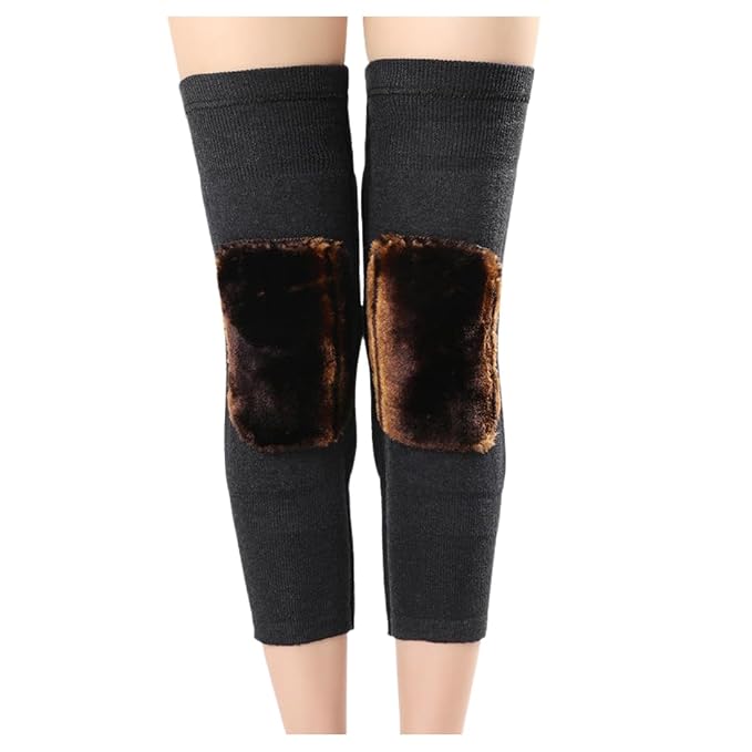 Black leg warmers with brown fur patches on a white background