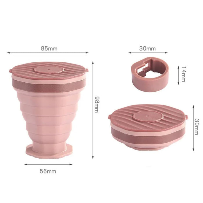 Collapsible pink cup with measurements on a white background