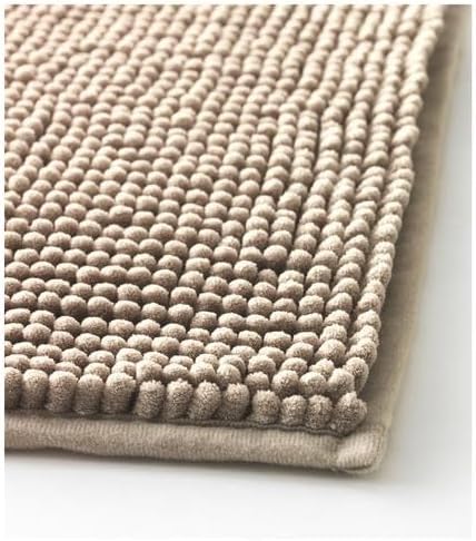 Close-up view of the IKEA TOFTBO pedestal mat in beige—shows a soft, plush surface made of tightly packed looped fibers for enhanced comfort and water absorption. The detailed texture emphasizes cushioning and coziness, ideal for placement around bathroom fixtures like toilets or sinks –50610268