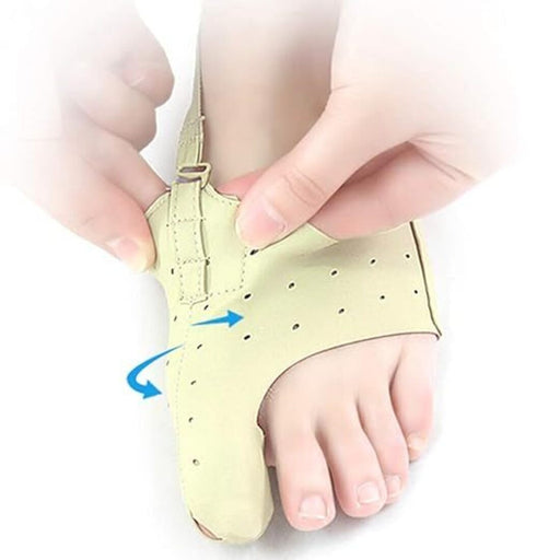 "Beige orthopedic big toe correction device with breathable perforations and an adjustable strap. Designed for bunion relief and toe alignment support, with a blue directional indicator for securing the fit.-3851431239039
