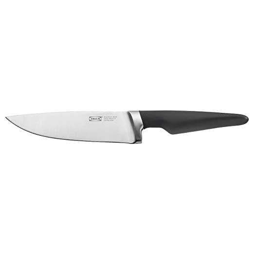 Knife with black handle and silver blade on a white background
