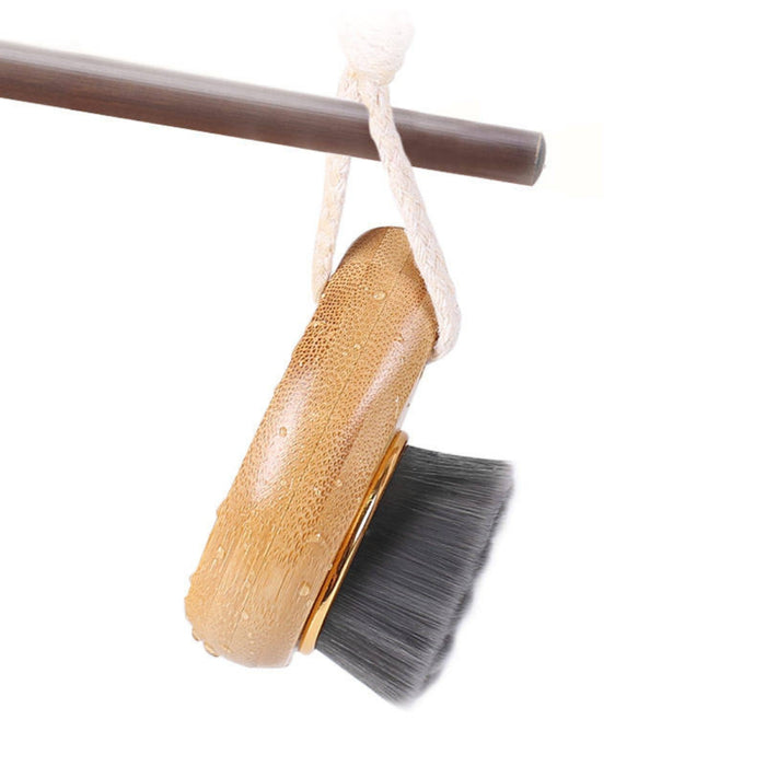 Bristle brush with wooden handle on a white background