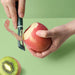 Compact vegetable peeler and slicer kitchen accessory for quick and efficient cooking prep.
