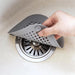 Non-slip rubber edges on shower drain strainer for secure fit & slip resistance.