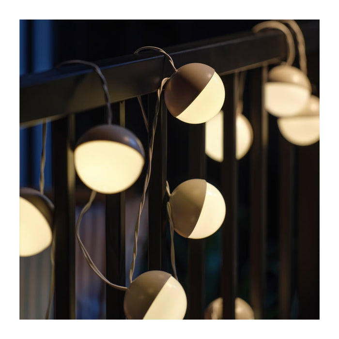 String lights with half-circle bulbs on a dark background