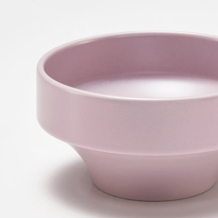 Close-up of SPJUTLILJA bowl in light purple geometric design, wide cylindrical upper section tapering to narrow base