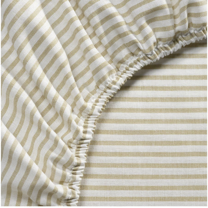 Close-up of beige and white striped fabric with a textured pattern
