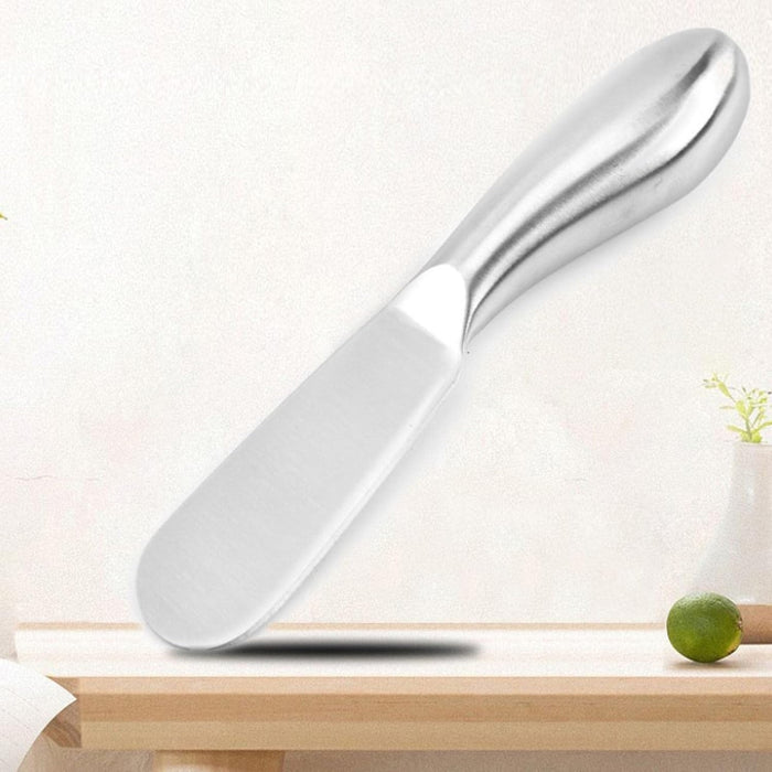 Digital Shoppy Multi-functional Cheese Knife, sleek stainless steel spreader on table with decorative background