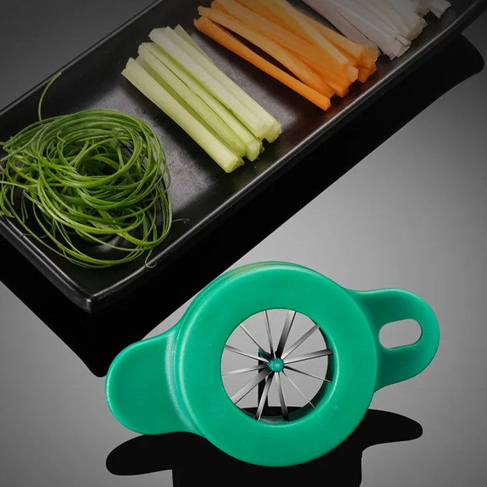 Green circular herb stripping tool shown slicing long stems through radial blades – used for prepping leafy vegetables and herbs – 1598451114240 13941221