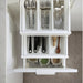 White kitchen drawer with cutlery and spices