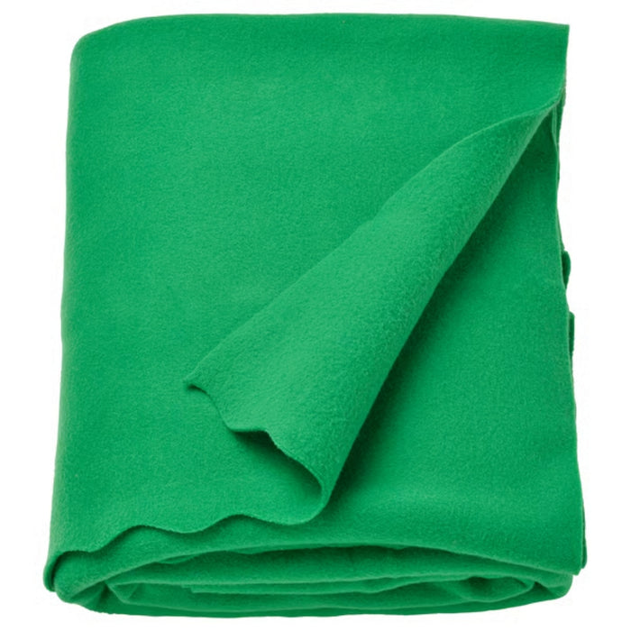 DAGGKÅPOR throw, green, 130x170 cm. Soft textured fabric shown folded with lifted corner to highlight thickness – ideal for sofa layering or cosy bed setup – 90602695.