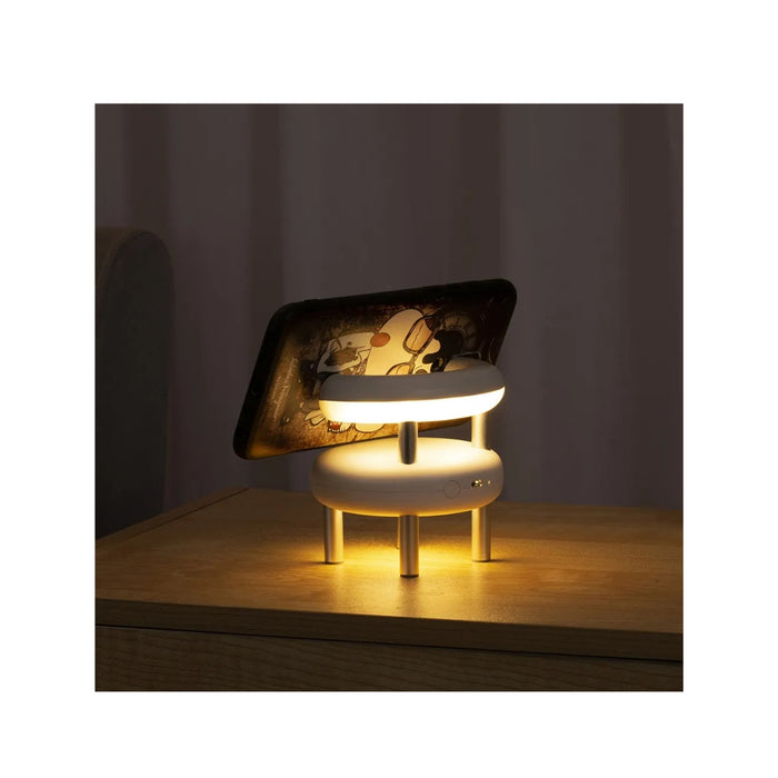 Small lamp with a wooden base on a dark background