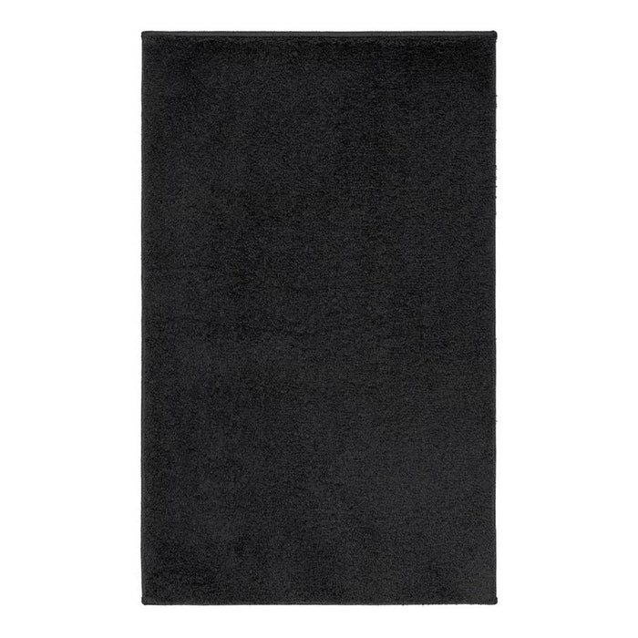 Black rectangular rug on a white background