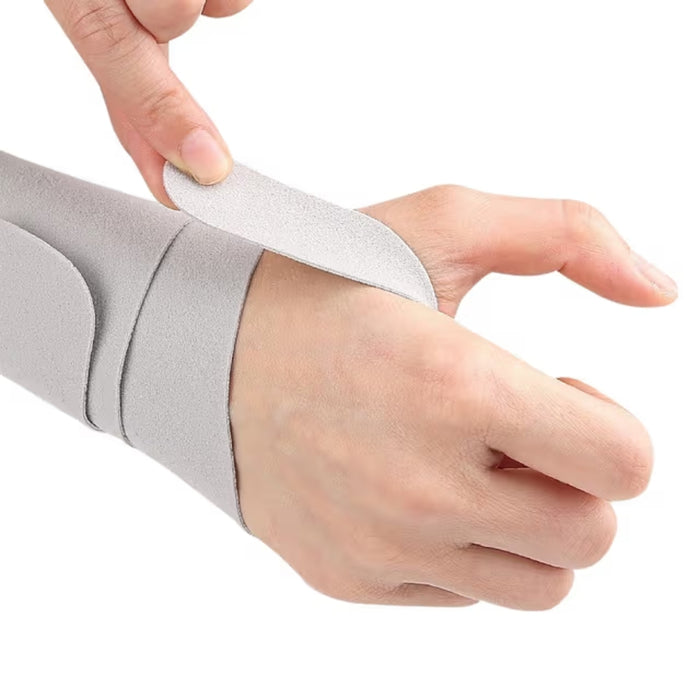 Close-up of wrist brace gray strap being fastened securely on wrist