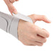  Close-up of wrist brace gray strap being fastened securely on wrist